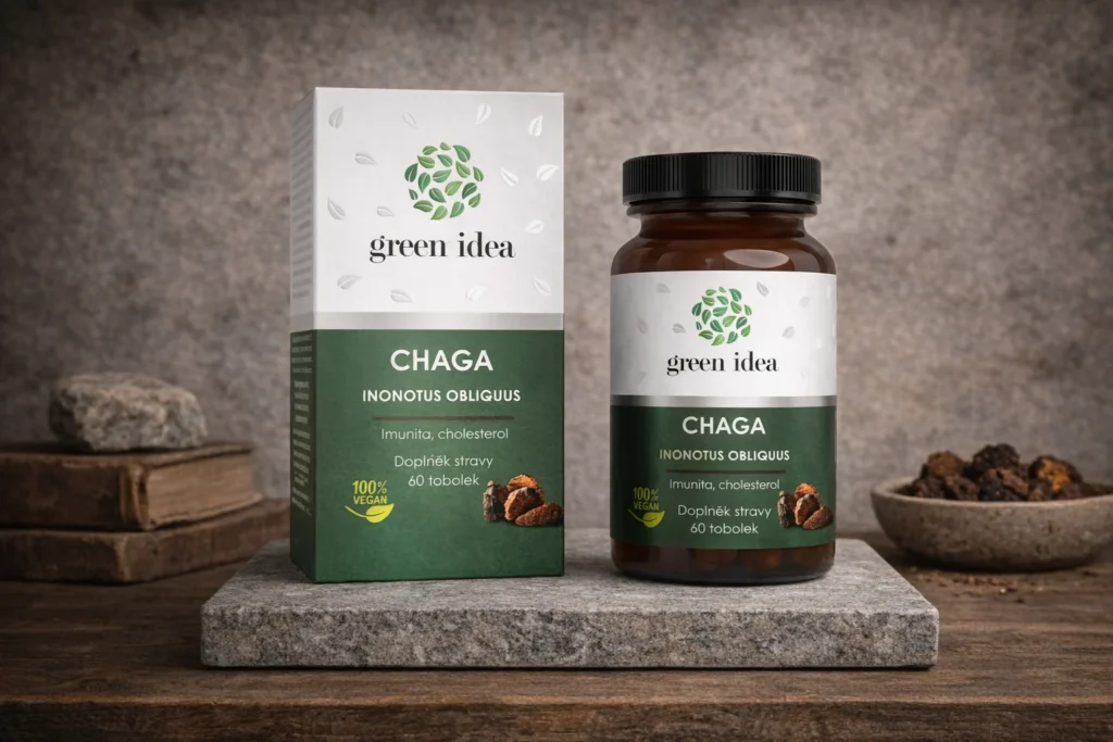 Chaga Green idea s krabičkou a fľašou na kamennej podložke